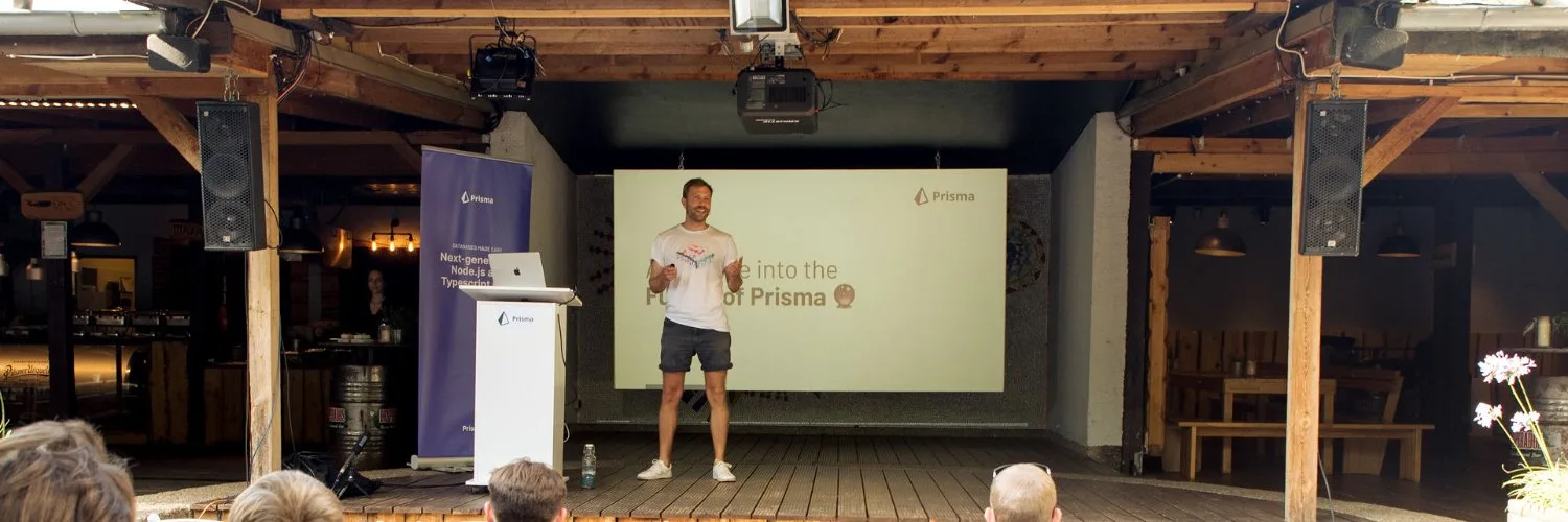 Niko speaking on stage at a developer conference